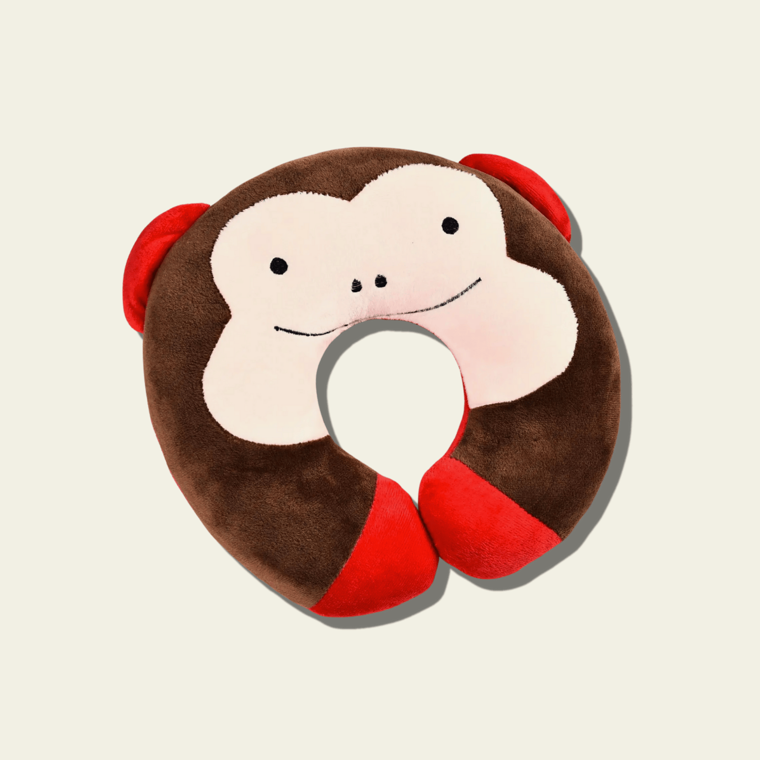 This adorable neck pillow for kids is designed to provide comfort and support during travel. Shaped like a cute brown and red monkey, it offers a fun and cozy experience for children while they rest on long car rides, flights, or during naps. The soft and plush material ensures comfort, while the pillow’s ergonomic design helps support the neck for a more relaxed journey.